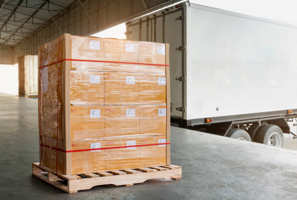 istock Cargo pallet shipment, Freight truck, Delivery service. Large cargo pallet boxes waiting to load into container truck. Logistics and Transportation 1277975527