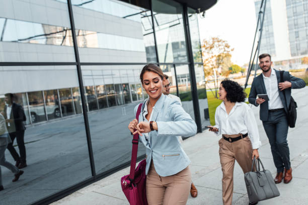 istock Business people going on work walking outside in front of office buildings. 1277976793