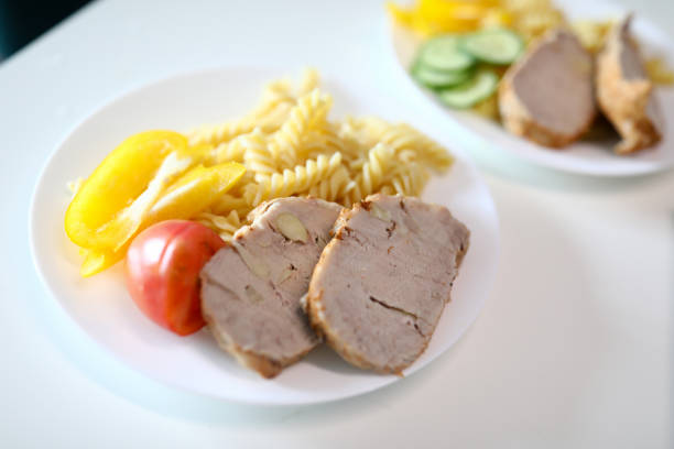 on table are plates food, meat and side dish. videography educational and business events. learn to beautifully serve and serve your culinary masterpieces. Dinner at home in restaurant, feed family