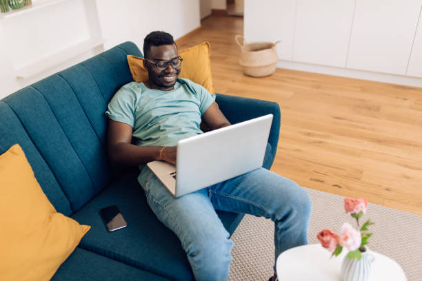 istock African-American man working from his living room 1277984450