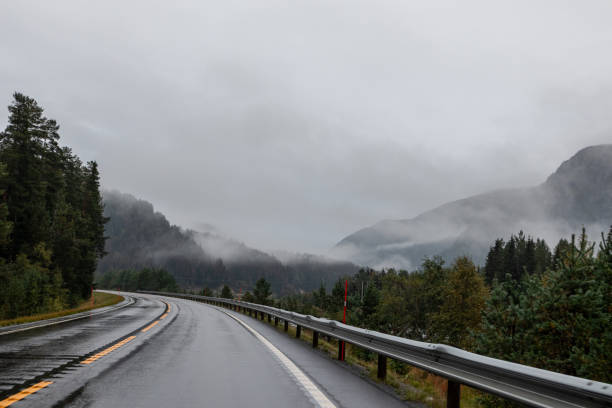istock Highway road in a misty mountains of Norway 1277984473