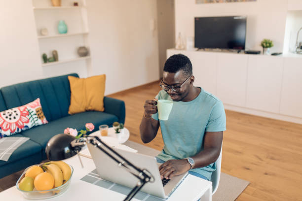 istock Young African-American man enjoying working from home 1277984481