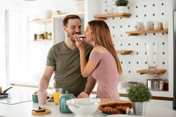 istock Young couple making breakfast at home. 1277985258