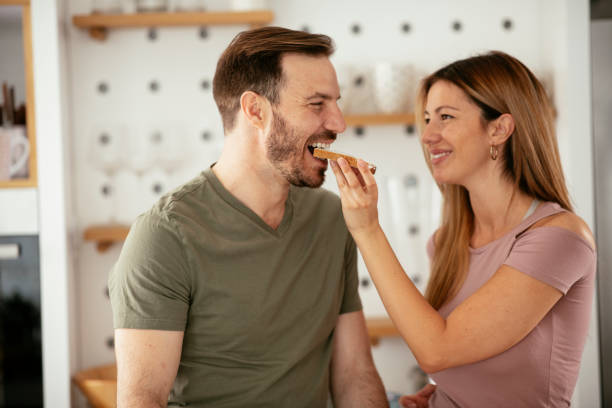 istock Young couple making breakfast at home. 1277985458