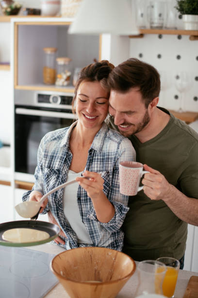 istock Young couple making pancakes at home 1277985543