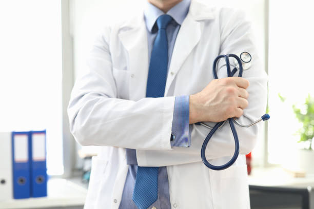 istock Doctor standing in office with stethoscope in hand 1277986439