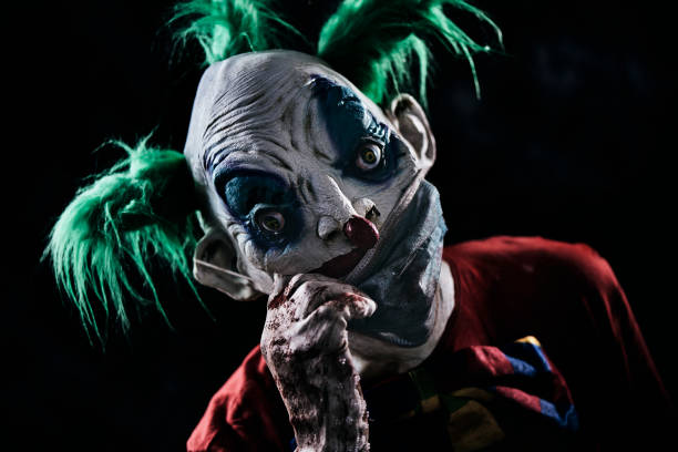 istock disturbing evil clown wearing a face mask 1277988981