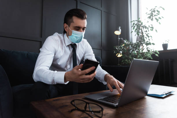 istock Businessman wearing prevention mask during his work in an office 1277992109