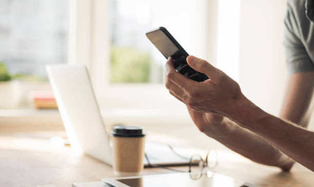 istock Man student or businessman using smart phone at home 1277995140