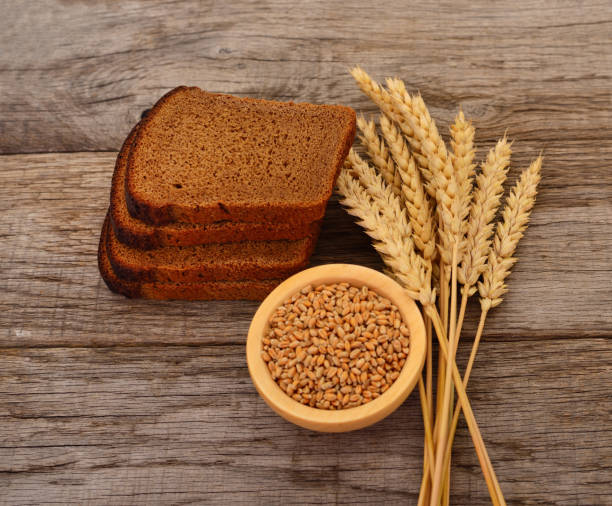 istock Wheat in a bowl, ears and bread. 1277995407