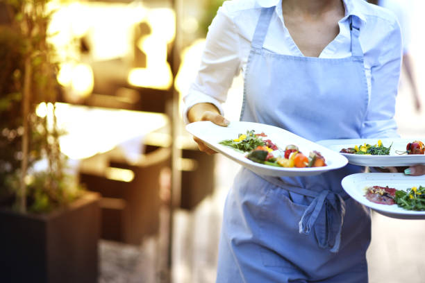 Waitress at work Waitress wears food at work in the restaurant minimum wage stock pictures, royalty-free photos & images