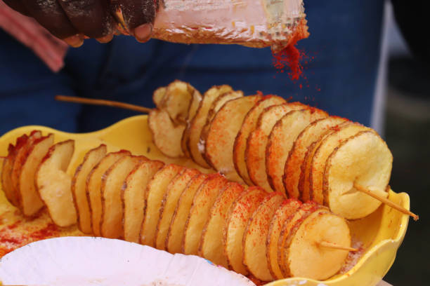 istock Famous Popular Indian Fried Snacks Ready To Serve Spring Potato With Spices Red Chilli Being Sprinkled After Cooking 1277996381