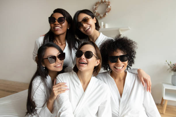 young multiracial diverse girl besties in gowns wearing dark sunglasses. - wedding african descent american culture bride imagens e fotografias de stock