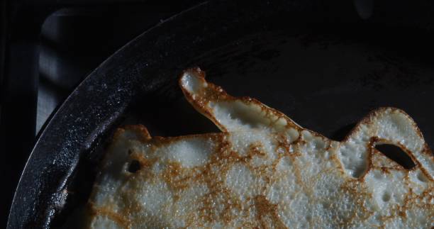 istock Frying crepes. Close-up. High angle view 1277996602