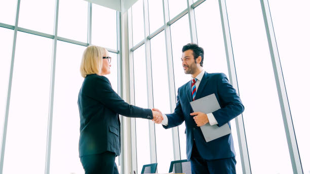 istock Business people handshake in corporate office 1278007574