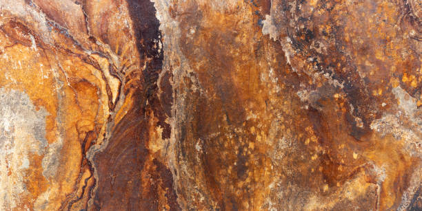 istock Brown orange slate stone slab in panoramic closeup 1278009075