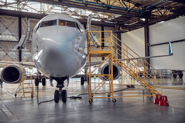 istock Airplane at parking apron in the aviation hangar 1278011225