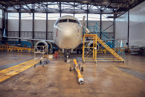 istock Passenger aircraft on service in an aviation hangar 1278011235