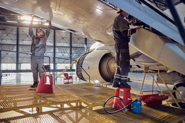 istock Engineer working on aircraft wing in aircraft maintenance factory 1278011254