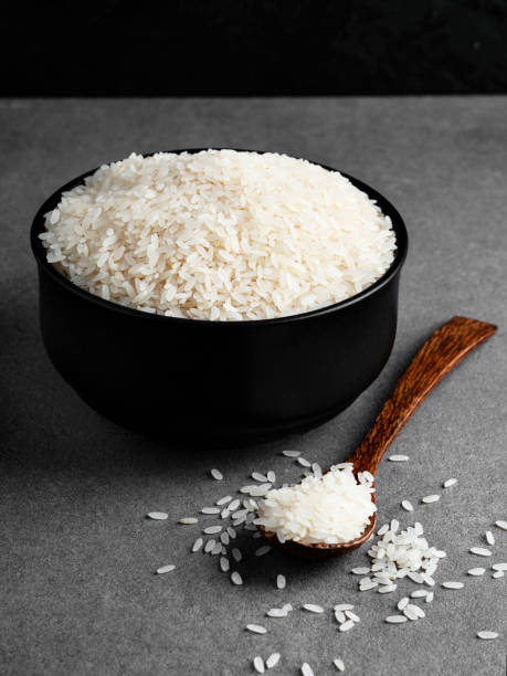 istock Rice grains,  White rice in the bowl, Rice with a spoon, 1278012522