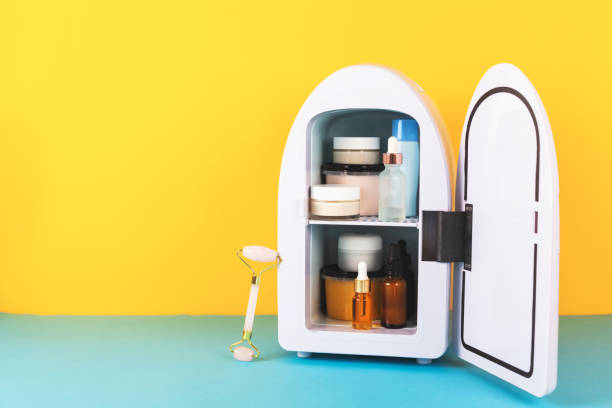 istock Mini fridge on yellow and blue background. Minimal composition. 1278013264