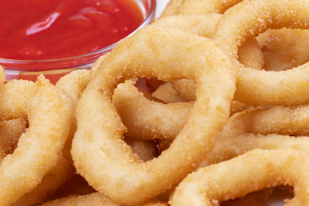 istock Delicious onion rings and ketchup on a plate 1278021177