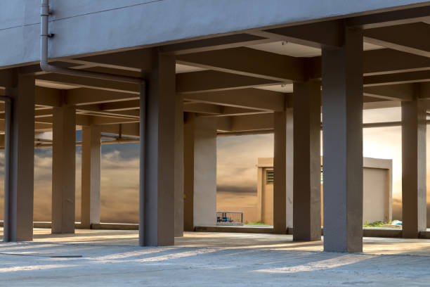 istock Sunlight shines through the concrete pillars under the building. 1278023838