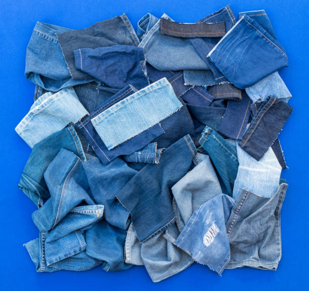 istock Pieces of cloth jeans on a blue background. 1278024196