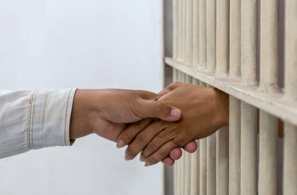 istock Hold hands with a female friend in a prison. 1278024283