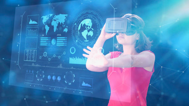 istock Young woman using VR glasses with digital media interface inside bright office building. Virtual reality technologies for education GUI (Graphical User Interface) concept. smart office 1278025217