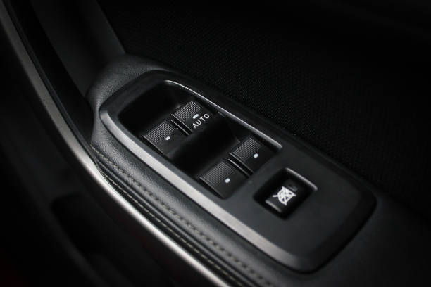 istock Car arm rest with Control Panel. Door Lock & Mirror Control. window adjustment buttons, door lock. Photography of a modern car. 1278025729