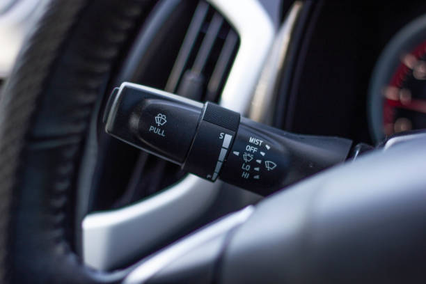 istock Windscreen wiper control switch in car. Wipers control. Modern car interior detail. adjusting speed of screen wipers in car. 1278025854