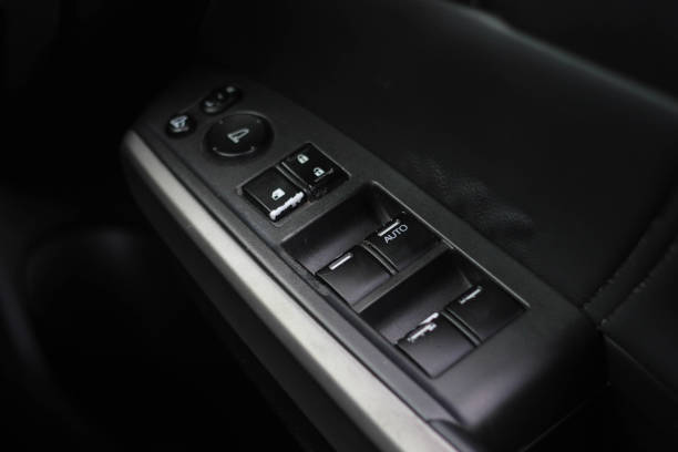 istock Car arm rest with Control Panel. Door Lock & Mirror Control. window adjustment buttons, door lock. Photography of a modern car. 1278025923
