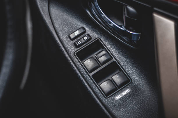 istock Car arm rest with Control Panel. Door Lock & Mirror Control. window adjustment buttons, door lock. Photography of a modern car. 1278025994