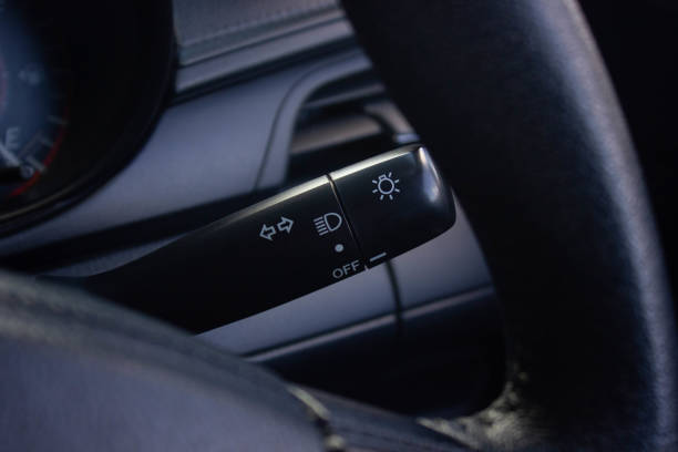 istock Switch off lights in a car. close-up Car integrated turning indicator with headlight switch toggle. 1278026014