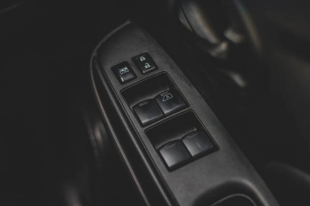 istock Car arm rest with Control Panel. Door Lock & Mirror Control. window adjustment buttons, door lock. Photography of a modern car. 1278026074