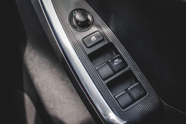 istock Car arm rest with Control Panel. Door Lock & Mirror Control. window adjustment buttons, door lock. Photography of a modern car. 1278026084