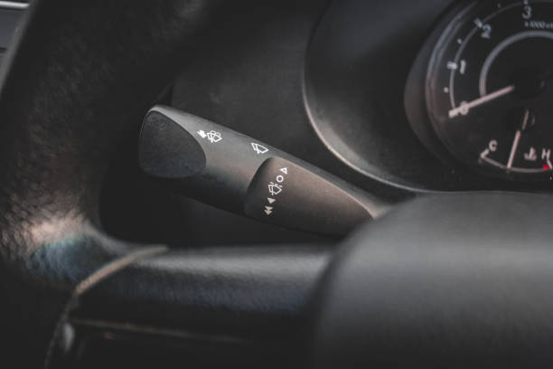 istock Windscreen wiper control switch in car. Wipers control. Modern car interior detail. adjusting speed of screen wipers in car. 1278026093