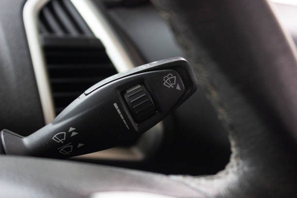 istock Windscreen wiper control switch in car. Wipers control. Modern car interior detail. adjusting speed of screen wipers in car. 1278026103