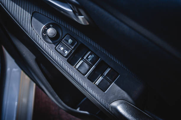 istock Car arm rest with Control Panel. Door Lock & Mirror Control. window adjustment buttons, door lock. Photography of a modern car. 1278026185