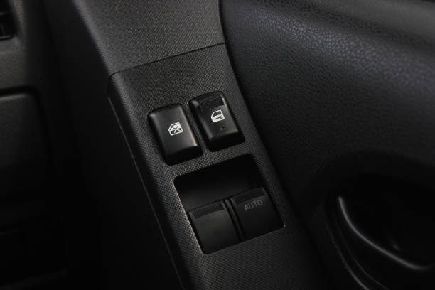 istock Car arm rest with Control Panel. Door Lock & Mirror Control. window adjustment buttons, door lock. Photography of a modern car. 1278026195