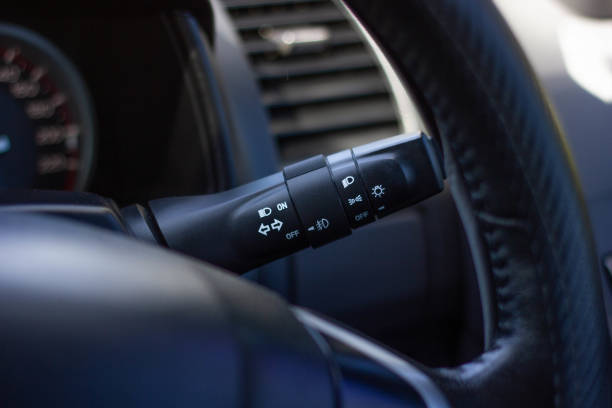 istock Switch off lights in a car. close-up Car integrated turning indicator with headlight switch toggle. 1278026228