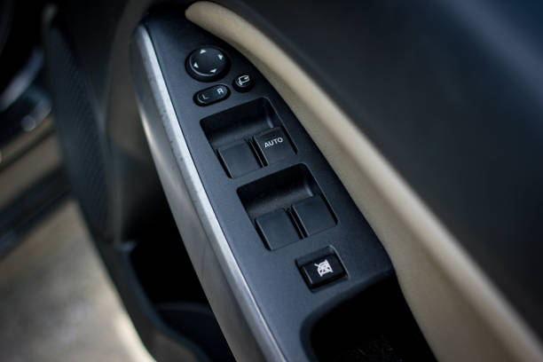 istock Car arm rest with Control Panel. Door Lock & Mirror Control. window adjustment buttons, door lock. Photography of a modern car. 1278026267