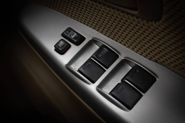 istock Car arm rest with Control Panel. Door Lock & Mirror Control. window adjustment buttons, door lock. Photography of a modern car. 1278026294