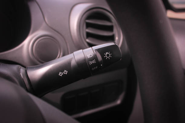 istock Switch off lights in a car. close-up Car integrated turning indicator with headlight switch toggle. 1278026300