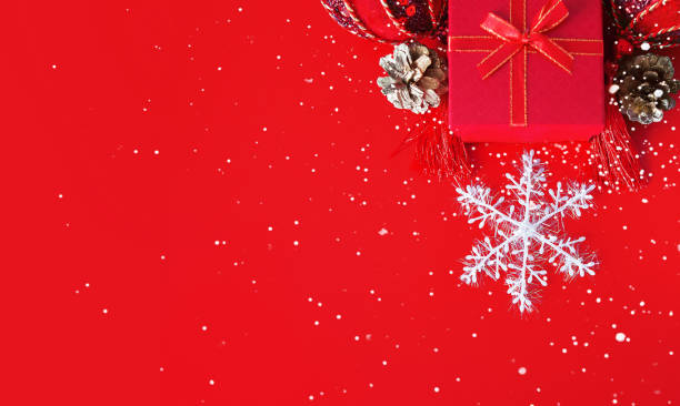 istock Decorative white snowflake, red present box, golden cones and shiny derative balls 1278026479