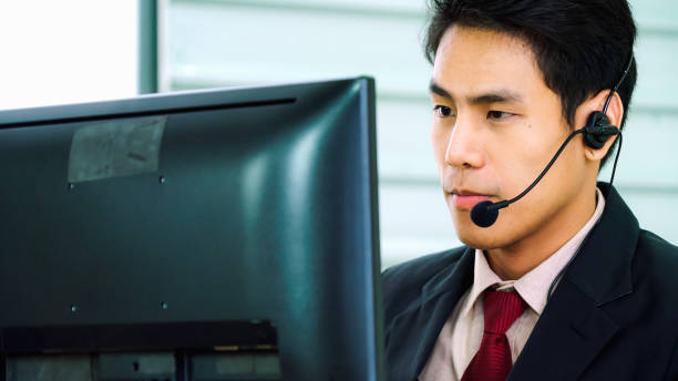 istock Business people wearing headset working in office 1278028013