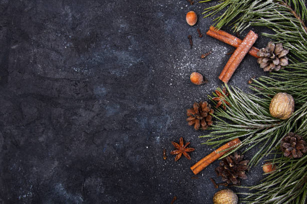 istock Beautiful Christmas Background with copy space for your text. Pine branch, cones, cinnamon, nuts covered with snow 1278029343