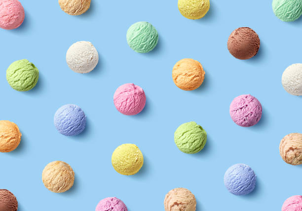 Colorful pattern of different ice cream scoops on blue background Colorful pattern of ice cream scoops of different colors and flavors on blue background, top view sphere photos stock pictures, royalty-free photos & images