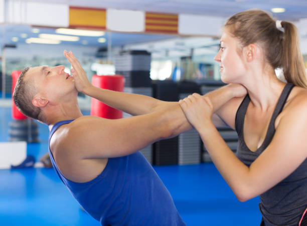 istock Attractive woman is fighting with trainer 1278032501